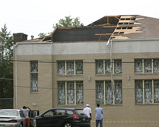 ROBERT K. YOSAY | THE VINDICATOR..- Mt Calvary Church on Oak Hill suffered severe damage as the roof  was ripped off and landed across  Oak Hill in a vacant lot -  firefighters did not think anyone was injured - A late afternoon summer thunderstorm hit the southside of Youngstown - taking down limbs, trees and knocking out electric -  the RIBFEST at the Covelli Centre had several people injured when tents were blown down ...-30-