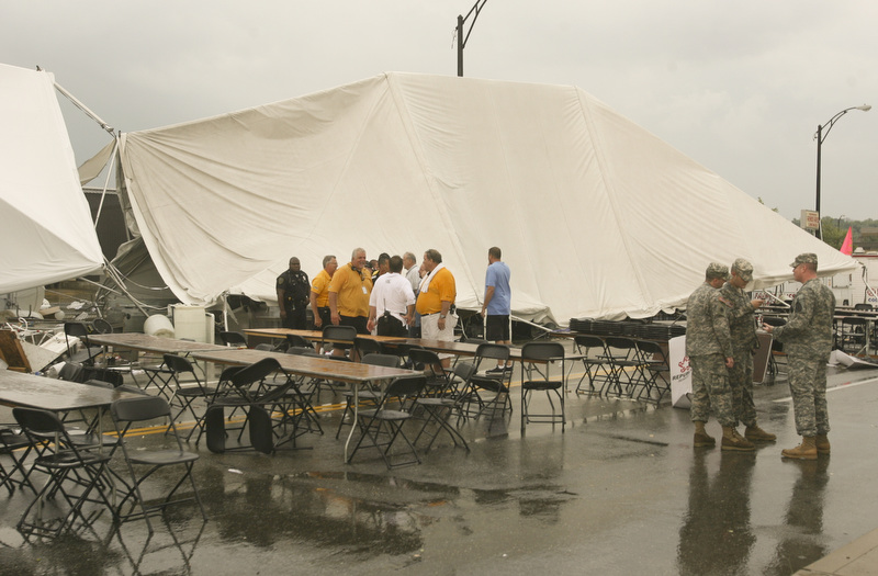 ROBERT K. YOSAY | THE VINDICATOR..A late afternoon summer thunderstorm hit the southside of Youngstown - taking down limbs, trees and knocking out electric -  the RIBFEST at the Covelli Centre had several people injured when tents were blown down ...-30-