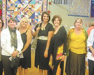 The YWCA’s 29th Annual Women Artists: A Celebration art show resulted in awards for some of the artists, including, from left: Sharon Meenachan, Jo Ann Buzulencia, Joyce Garvey, Tazim Jaffer, Salli Kowalski, Catherine Theodore and Kathleen Terlecky.