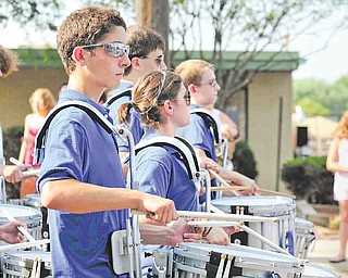 Members of the Hubbard High School drumline march down East Liberty Street in Hubbard during the Family Funday parade.