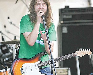 Lead singer and guitarist Dustin Dockery of the Heights Band performs at the Greater Youngstown Wing Fest outside Covelli Centre on Saturday evening.