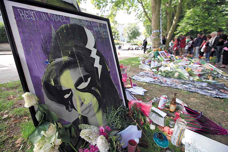Flowers and tributes left by mourners in Camden Square, outside the house of Amy Winehouse after her death. Mitch Winehouse, Amy Winehouse’s father, greeted and thanked mourners Monday for coming to lay bouquets, messages and handwritten notes.