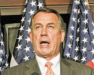 House Speaker John Boehner of Ohio, right, accompanied by Rep. Cathy McMorris Rodgers, R-Wash., gestures while speaking at The Republican National Committee on Capitol Hill in Washington, Tuesday, July 26, 2011.  (AP Photo/Carolyn Kaster)