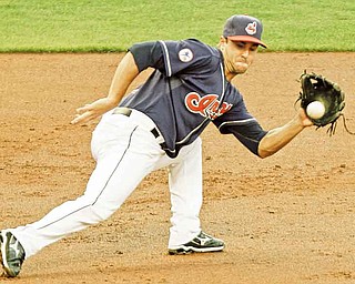 Cleveland Indians third baseman Jack Hannahan tracks down a ground ball by Los Angeles Angels' Jeff Mathis during the third inning of a baseball game, Tuesday, July 26, 2011, in Cleveland. Hannahan threw Mathis out at first. (AP Photo/Mark Duncan)