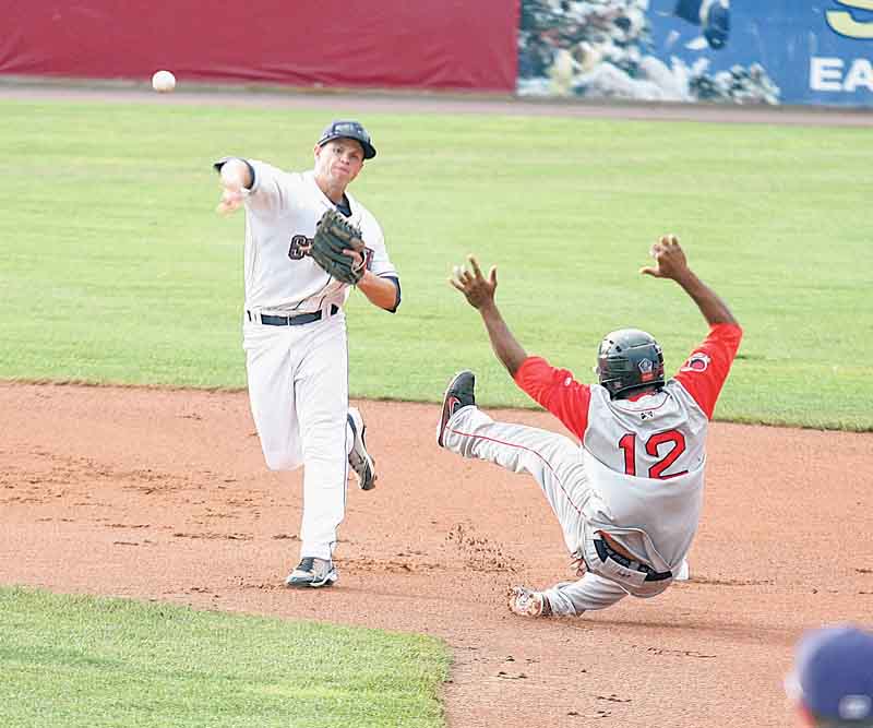 Scrappers infielder Todd Hankins fires to first for a double play as Lowell baserunner Keury De La Cruz (12) hits the dirt during Wednesday’s game at Eastwood Field.
