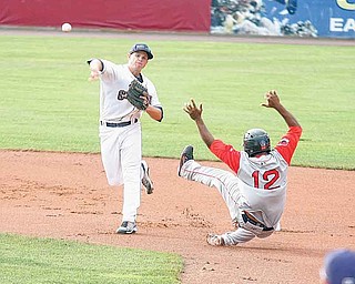 Scrappers infielder Todd Hankins fires to first for a double play as Lowell baserunner Keury De La Cruz (12) hits the dirt during Wednesday’s game at Eastwood Field.