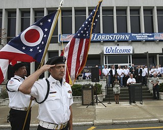 ROBERT  K.  YOSAY  | THE VINDICATOR --..John Julio Salutes at opening ceremony at GM Lordstown open house - over 50, 000 dollars was given away from GM endowments to 5 area agencies..The Lordstown Complex is a General Motors automobile factory in Lordstown, Ohio comprising three facilities: Vehicle Assembly, Metal Center, and Paint Shop. The plant opened in 1966. Lordstown currently builds the global Chevrolet Cruze compact car.The plant welcomed over 9000 visitors to view the  Metal Center ( west plant) and the asembly plant on Thursday.--30-..(AP Photo/The Vindicator, Robert K. Yosay)