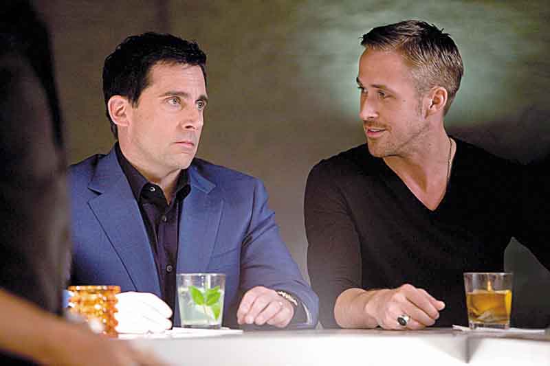 Steve Carell as Cal Weaver and Ryan Gosling as Jacob Palmer in "Crazy Stupid Love."