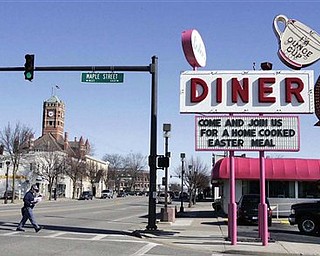 In this April 8, 2009 photo, Lester's Diner is shown at its location on Main Street in Bryan, Ohio. The sale of a Lester's Diner includes its iconic sign, which would look familiar to fans of the old TV sitcom "Alice." Lester's aging owners closed the place in May and put it up for sale. The buyers posted a sign outside this week saying the diner would become part of a regional group of Four Seasons restaurants serving American-Greek food. (AP Photo/The Blade/Dave Zapotosky)