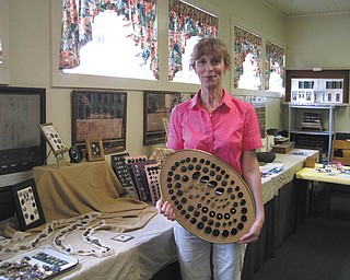 Barb James of Berlin Center shows off her extensive button collection. The collection will be featured at the Heritage Day event from noon to 5 p.m. Aug. 7 at the Ward-Thomas Museum in Niles.