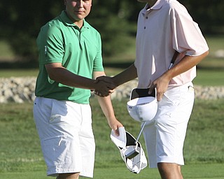 ROBERT  K.  YOSAY  | THE VINDICATOR --..James LaPolla  winner of the tourney shakes the hand of  Dominic Carano  on the 18th hole. -- The Vindicator Greatest Jr. Golfer of the Valley -at Trumbull Country Club in Warren -.--30-..(AP Photo/The Vindicator, Robert K. Yosay)