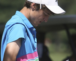 ROBERT  K.  YOSAY  | THE VINDICATOR --..Brandon Pluchinsky  checks his score as he enters the back nine - Brandon placed 3rd. -- The Vindicator Greatest Jr. Golfer of the Valley -at Trumbull Country Club in Warren -.--30-..(AP Photo/The Vindicator, Robert K. Yosay)