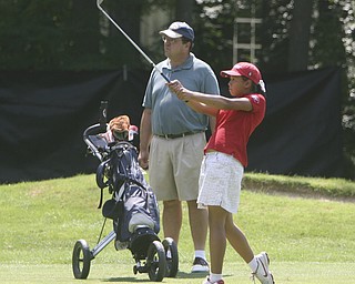ROBERT  K.  YOSAY  | THE VINDICATOR --...Jacinta Pikunis lands on the green after  chipping in at Trumbull Country Club - her Dad Michael was her caddy - The Vindicator Greatest Jr. Golfer-at Trumbull Country Club in Warren -.--30-..(AP Photo/The Vindicator, Robert K. Yosay)