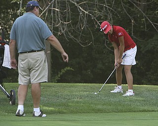 ROBERT  K.  YOSAY  | THE VINDICATOR --...Jacinta Pikunis gets advice from her dad and Caddy as she chips from the ruff to the gree on the back nine  at Trumbull Country Club - her Dad Michael was her caddy - The Vindicator Greatest Jr. Golfer-at Trumbull Country Club in Warren -.--30-..(AP Photo/The Vindicator, Robert K. Yosay)