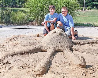 Anthony Stiles and Shane Vantell, both 13, of Austintown, show off their first-place sand sculpture &#8220;Mr. Octopus&#8221; in the children&#8217;s sculpting competition at Mill Creek Park&#8217;s Sunfest. The boys each received a Handel&#8217;s gift card for their efforts during the daylong event at the James L. Wick Recreation Area in the Youngstown park.