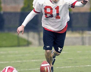 Youngstown State sophomore Nick Liste practices kicking during an April practice. Liste, Jamaine Cook and offensive lineman Dan Radakovich, were named to the Missouri Valley Football Conference preseason all-conference team Monday.