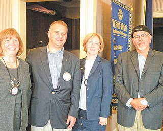 Rotarians step up to lead: At the Rotary Club of Youngstown’s Club Assembly on July 6, officers for the 2011-12 year were installed. From left to right are Suzanne Fleming, president; Scott Schulick, vice president; Carol Chamberlain, treasurer; and Ronald Faniro, president elect. Marc Mazzella, secretary, was not present when the photo was taken. Rotary Club of Youngstown meets every Wednesday at noon at the Youngstown Club. For information about becoming a member or attending a meeting as a guest call the Rotary office at 330-743-8630 on Tuesdays from 9:30 to 11:30 a.m. and Wednesdays from 9:30 a.m. to 2 p.m.