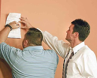 Boardman police Sgt. John Allsopp, left, and Jeff Barone, treasurer of the Boardman Coalition Against Crime, tally votes.