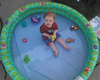 Austin Wentz, 15-month-old son of Chris and Chrissie Wentz of Austintown, seems to be right at home playing in his pool.
