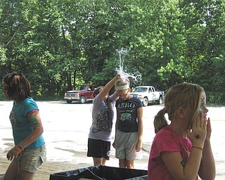 Starrash Howell of Austintown breaks a water balloon over the head of Kaylin Bowman of Youngstown during the Wickliffe BlockWatch Block Party's annual water-balloon fight on July 9. Kaylin is the niece of Shawne Wilfong of Austintown, who sent in the photo.