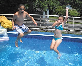 Nicholas Workman and Madison Horvath, both of New Middletown, throw caution to the wind and jump on in! Photo submitted by Melanie Workman.