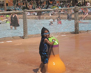 Jibril James Jackson of Youngstown takes a break from swimming to enjoy the spray. Photo submitted by Jaietta Jackson of Youngstown.