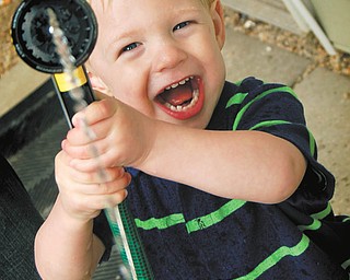Camden Cox, 2, of Austintown, is ready to cool you off, too! Photo submitted by Lindsy Cox.