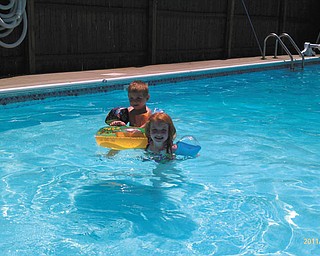 Emery Macdonald, 2, and Mackenzie Macdonald, 6, both of Struthers, keep their fun afloat in the pool. Heather Macdonald sent in this photo.