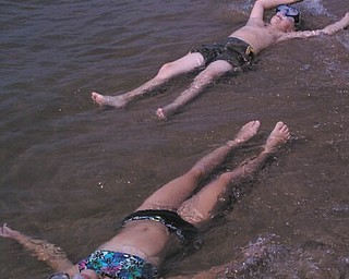 Andrea and David Dull, children of Marla and Dave Dull II of Hubbard, cool off in Lake Michigan during the Fourth of July holiday. They were visiting their Aunt Mandy and Uncle Tony Kirk in St. Joseph, Mich. Photo sent in by Marla Dull.