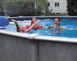 Yay for a pool spray on a hot summer day! Johna, left, Scarlet and Kalli have a blast in Boardman. Photo sent in by Lori Tomko-Hromyak.
