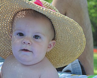 Bianca Craig, daughter of Brandon and Marcie Craig of Wooster, enjoys a wading pool and Papa and Nana Craig's farm in Salem. Photo sent in by Bev Craig.
