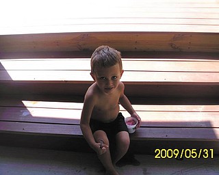 Vas Krinos of Campbell knows he's got to stay out of the sun or his ice cream will melt! Photo sent in by his mother, Stephanie Krinos.