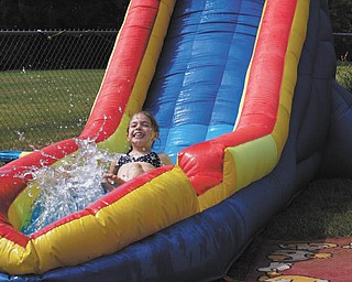 Wheeeee! Anna Guerra of McDonald heads down a slide at her grandparents' house in Niles during a Fourth of July party. Photo sent in by Cathy Guerra.
