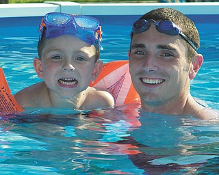 Landon Malmfeldt, 4, enjoys some pool time with Ronnie Malmfeldt in Youngstown.