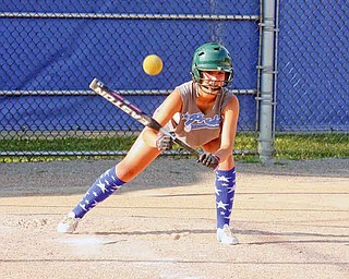 Jenna Schettler of the Poland Junior League softball team works on bunting during a recent practice. Poland will represent Ohio in a regional tournament.