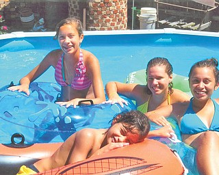 It's cool to hang out at Grandma's pool! Aida Pacheco of Campbell sent in this photo of her grandchildren.  In yellow, back center, is Sarah Pacheco, daughter of Vincent and Joyce Pacheco of Pittsburgh. From left are siblings Victoria, Stephen (front), and Olivia Pacheco, whose parents are Stephen and Racquel Pacheco of Canfield.