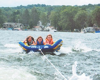 Caroline Tikkanen of Hudson, left, and Eliza and Mariah Blasko of Canfield go tubing on Lake Chautauqua in New York. Photo sent in by Paula Blasko of Canfield.