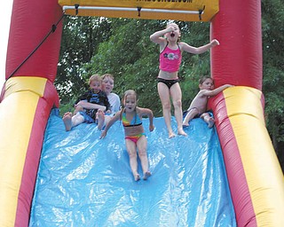 Austin Beck, Jimmie Meyer, Destiny Flaherty, Raelynn Meyer and Landon Malmfeldt, all of the Austintown/Youngstown area, found a way to stay cool during their great-grandmother's 80th birthday party.