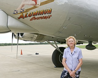 JESSICA M. KANALAS | THE VINDICATOR..Dixie Kosovec stands next to the plane art. ..-30-