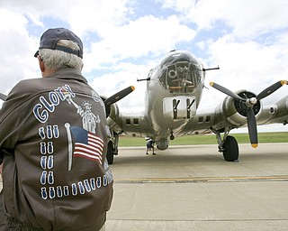 JESSICA M. KANALAS | THE VINDICATOR..Dick (Richard) Ames wears his flight jacket from his service in WWII...-30-