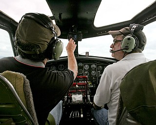JESSICA M. KANALAS | THE VINDICATOR..Co-pilots Dan Bowlin and Kent Holiday fly the B-17 on its tour that left from the Youngstown Airport...-30-