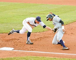 Mason Williams, can’t avoid the tag of Mahoning Valley Scrappers first baseman Jerrud Sabourin during Thursday’s game at Eastwood Field. The Scrappers won 4-0.