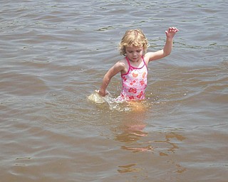 Rachel Lamb, 4, is playing in Lake Roaming Rock, Roaming Shores, Ohio. Her parents are Bruce and DeAnne Lamb of Canfield.