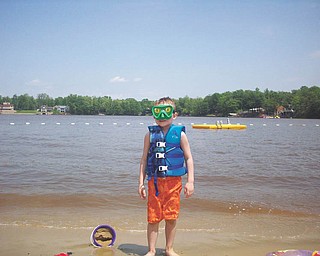 Ryan Lamb, 6, is on the beach at Roaming Shores, Ohio. He is the son of Bruce and DeAnne Lamb of Canfield.