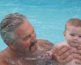Seven-month-old Cameron Mason, son of Beth and Matthew Mason, enjoys an afternoon swim with his Grandpa Mike Fox. Photo submitted by Laurie Fox (Cameron's grandma).