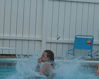 Savannah Wymer, 9, refreshes in the pool at the Poland home of her aunt and uncle, Linda and Randy Estes. Savannah's parents are Marion and Jeff Burns of North Lima. The photo was submitted by Laurie Fox of Lowellville, Savannah's aunt.