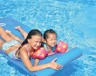 Norma Remias of Canfield sent this picture is of my two granddaughters, Brianna and Jenni-Lin, enjoying floating in the pool on the raft.