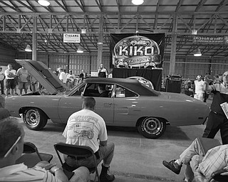 Going, going, gone: KIKO Classic Car Auctioneers auctioned off classic vehicles 26 years or older to several hundred bidders at Canfield Fairgrounds recently during Dave & Ed’s Summer Auto Event. The auction began with memorabilia such as oil cans, signs, oilers and a Sinclair gas pump that sold for $1,980. Highlights of the vehicle sales included a 1970 Plymouth Roadrunner, a 1969 Chevrolet Camaro and a 1924 T-Bucket. The next auction will be Sept. 10 in Sandusky.