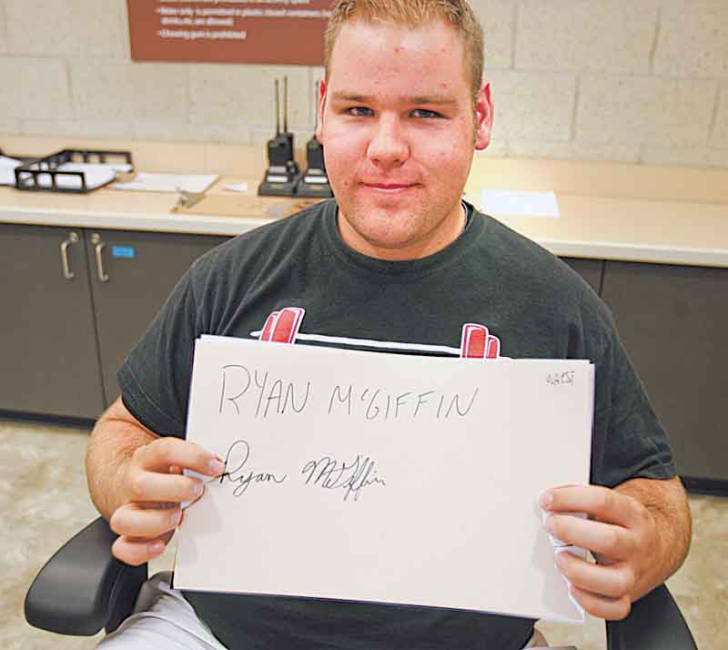 YSU junior Ryan McGiffin of Girard never uses cursive. Though his signature is legible, McGiffin said it is “terrible.”