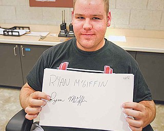 YSU junior Ryan McGiffin of Girard never uses cursive. Though his signature is legible, McGiffin said it is “terrible.”